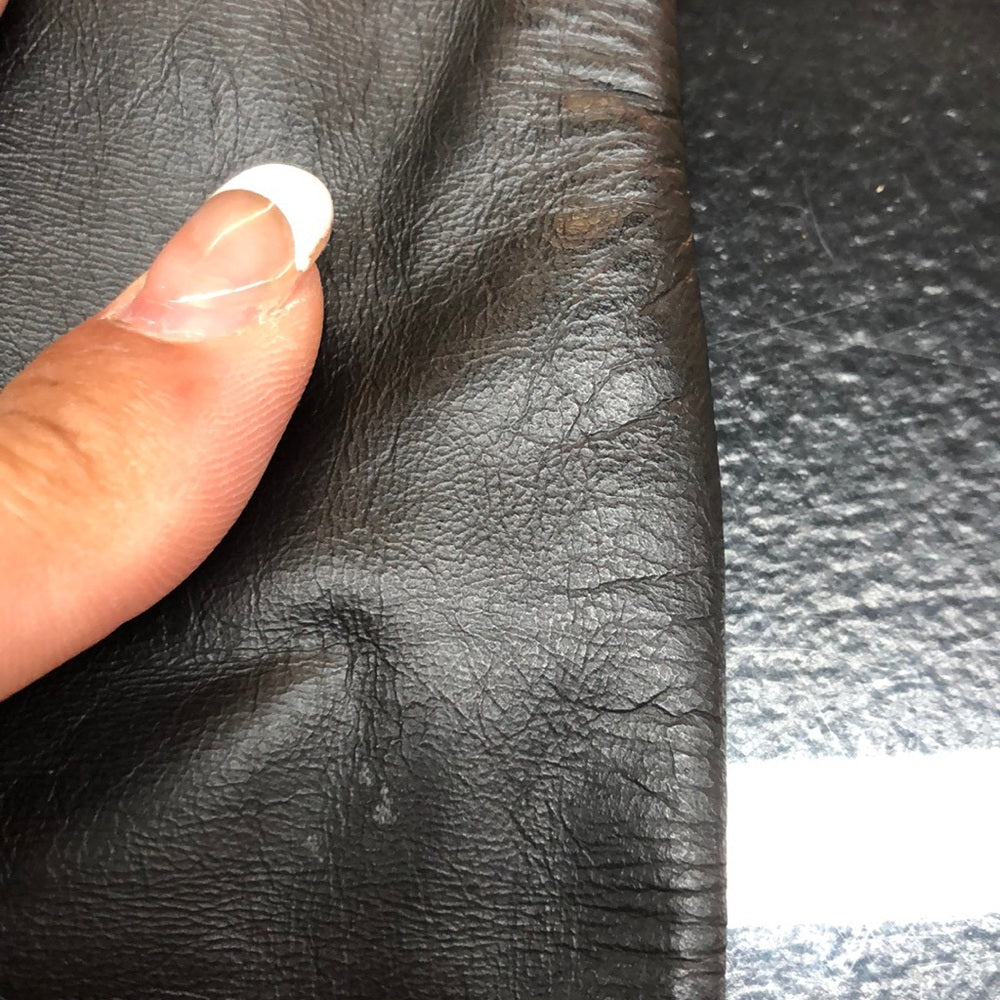 Size 7/8 lined leather skirt with small rear slit