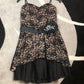 Black lace overlay over nude short formal dress