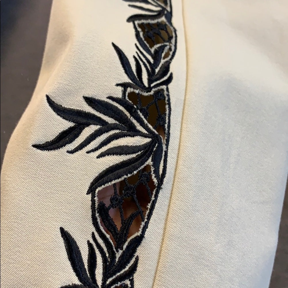 Size 8 pants  with peek thru cutouts on the side