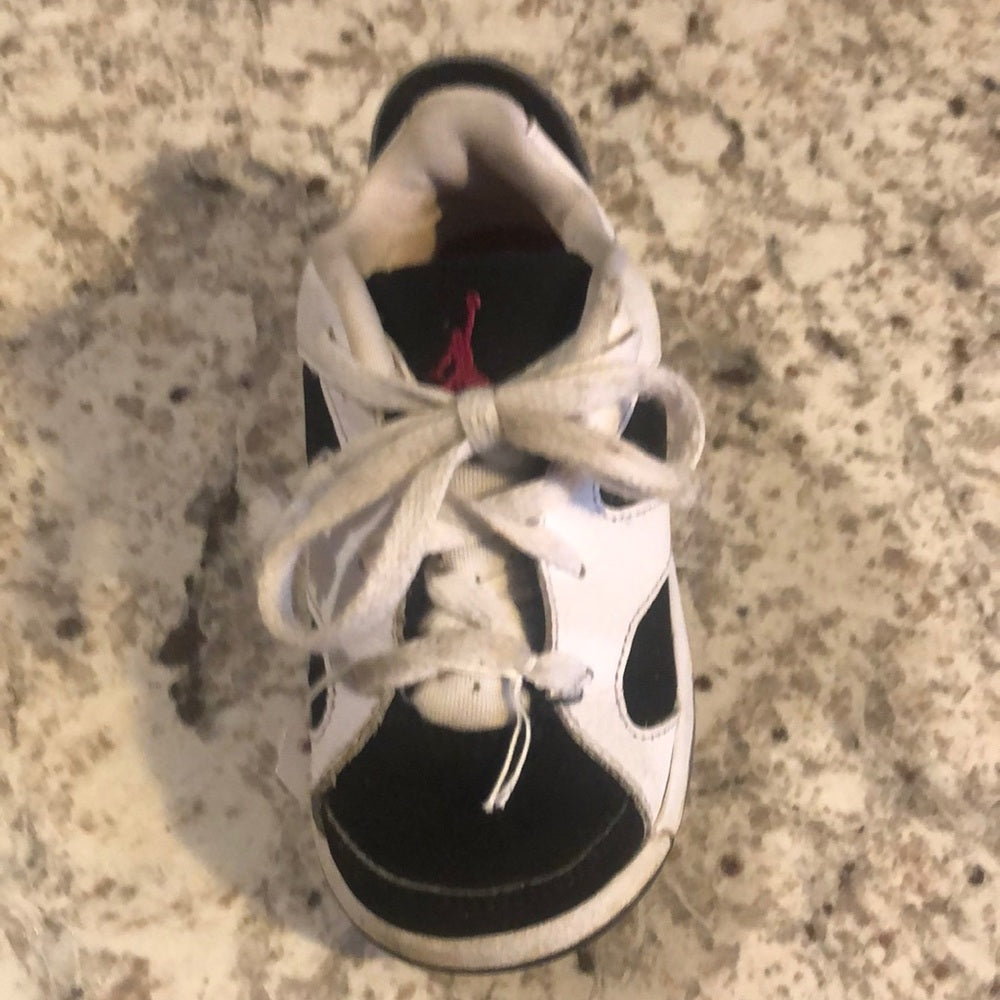 Jordan’s sz 7c white, black and purple sneakers